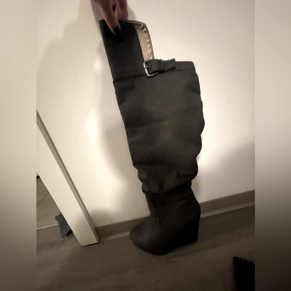Black wedge boots over the knee